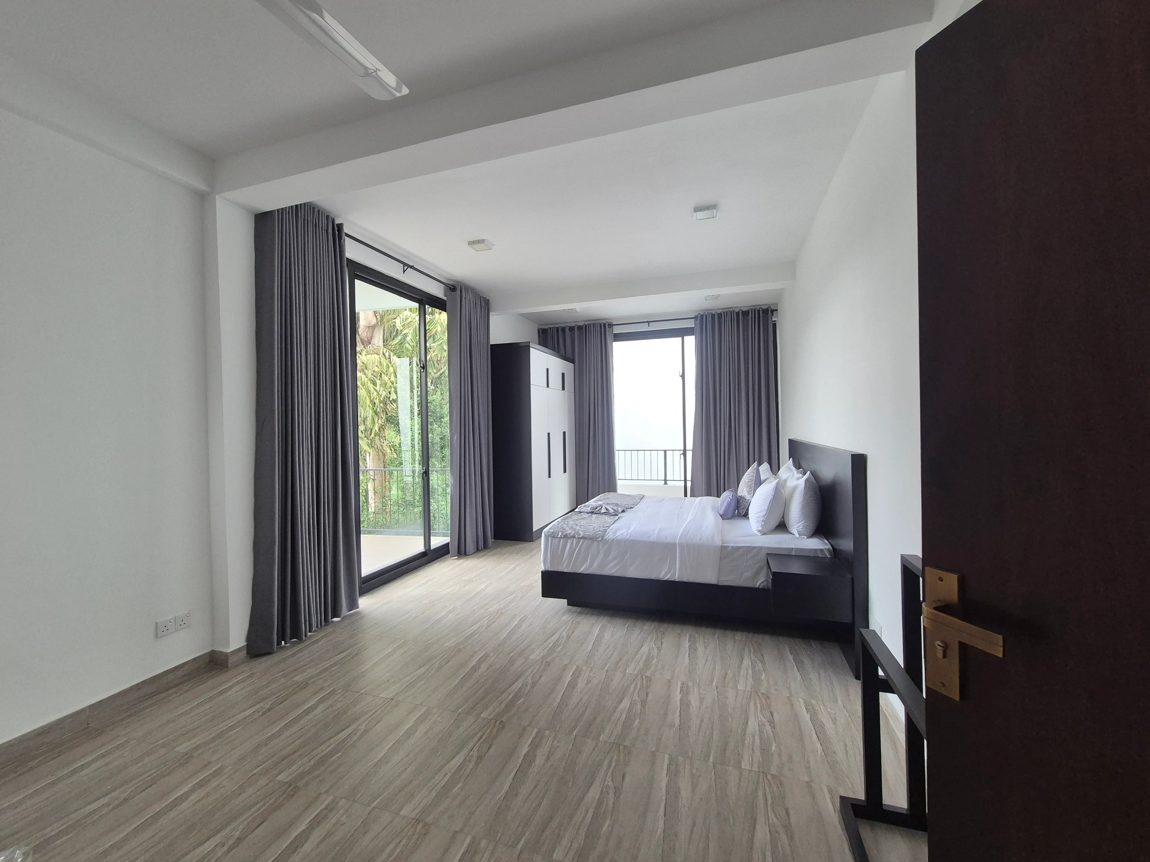 TenTwo master suite bedroom with en-suite bathroom and private balcony Kandy
